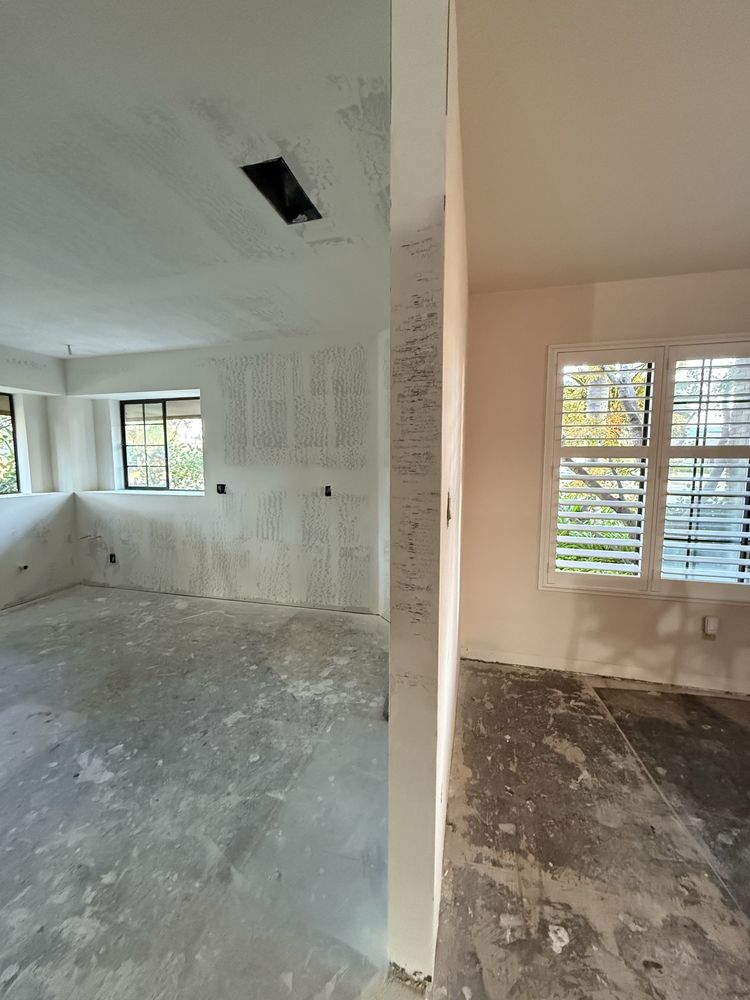 Textured drywall wall beside a window